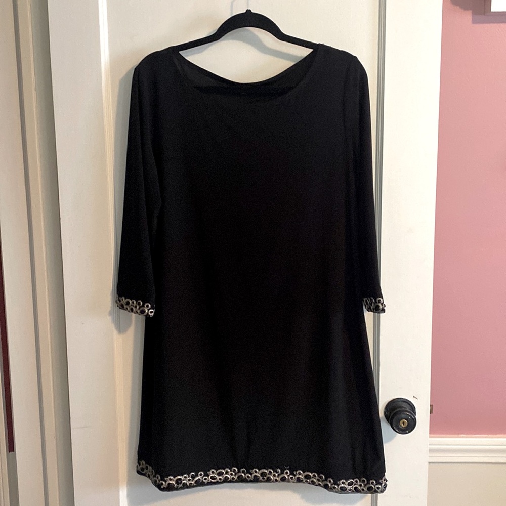 Black sheath embellish at wrist and hem